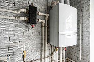 modern boiler installation with pipes on a gray wall efficiency and maintenance tips for 9 systems