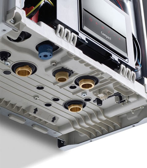 bottom view of a compact device showing various connection ports and fittings designed for installations and maintenance suitable for 12 applications